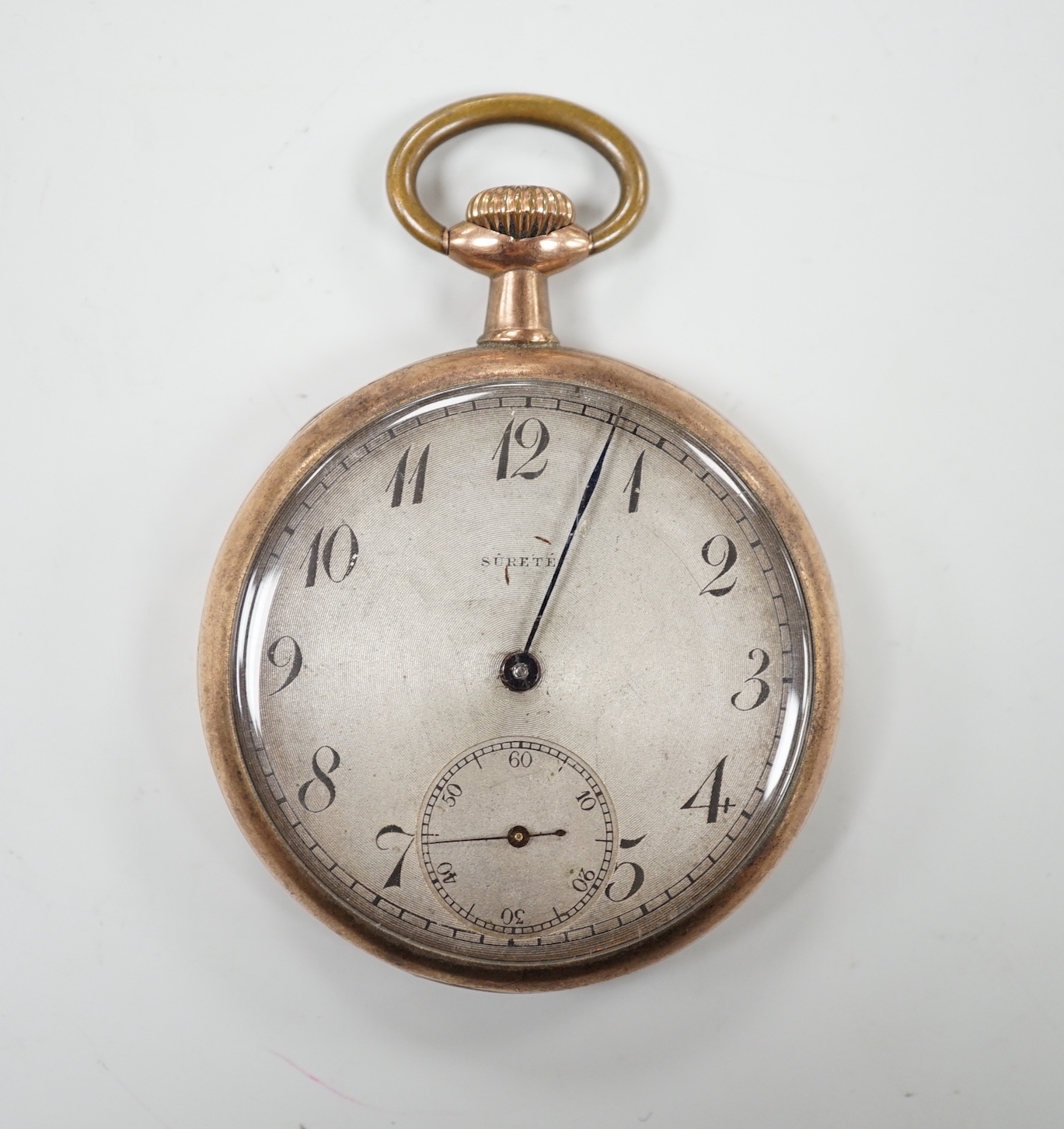 A yellow metal open faced keyless pocket watch, the Arabic dial with subsidiary seconds and inscribed 'Surete', (a.f.).